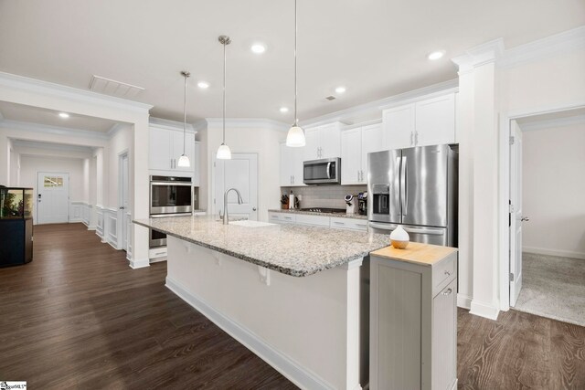 305 Kellen Ct, Duncan, SC 29334 - kitchen featuring stainless steel appliances, a large island, dark wood-style floors, a sink, and ornamental molding