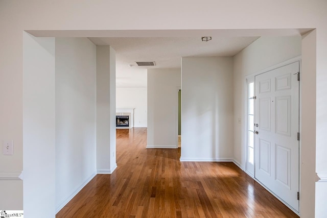 19 Hartwell Dr, Simpsonville, SC 29681 - entryway with wood finished floors, baseboards, and a fireplace