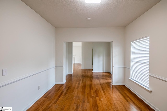 19 Hartwell Dr, Simpsonville, SC 29681 - spare room with wood finished floors, baseboards, and a textured ceiling