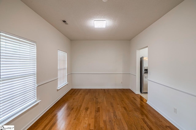 19 Hartwell Dr, Simpsonville, SC 29681 - unfurnished room with a textured ceiling, wood finished floors, and baseboards