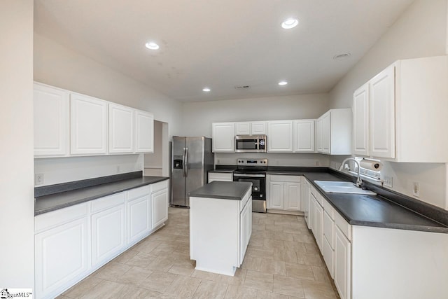 19 Hartwell Dr, Simpsonville, SC 29681 - kitchen with appliances with stainless steel finishes, a sink, dark countertops, a center island, and recessed lighting