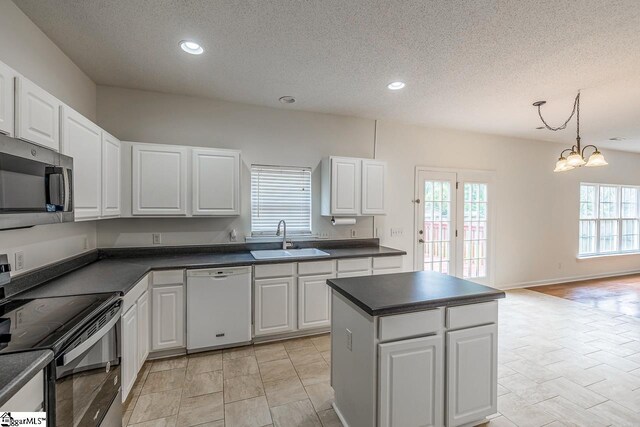 19 Hartwell Dr, Simpsonville, SC 29681 - kitchen with dishwasher, stainless steel microwave, a sink, black range oven, and dark countertops