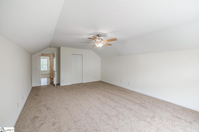 19 Hartwell Dr, Simpsonville, SC 29681 - bonus room featuring light carpet, lofted ceiling, a ceiling fan, a textured ceiling, and baseboards