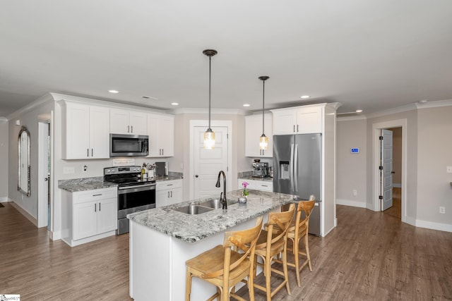 881 Cothran Rd, Inman, SC 29349 - kitchen with stainless steel appliances, a sink, ornamental molding, baseboards, and recessed lighting