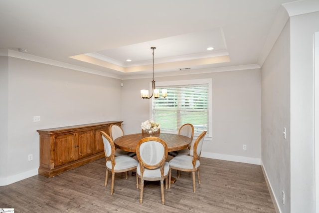 881 Cothran Rd, Inman, SC 29349 - dining area with a tray ceiling, a chandelier, wood finished floors, baseboards, and crown molding