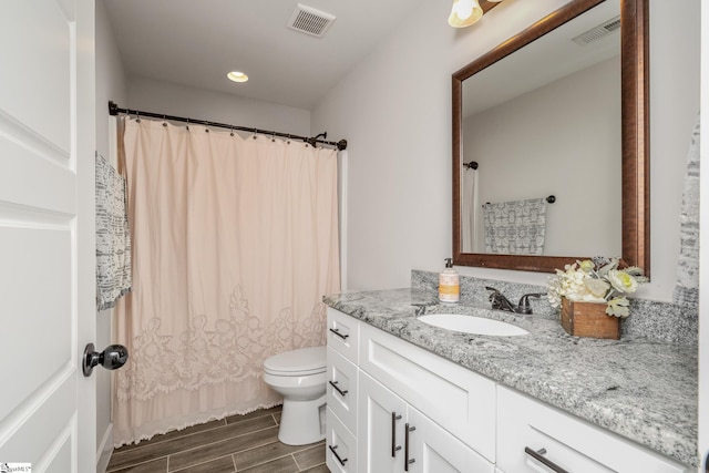 881 Cothran Rd, Inman, SC 29349 - bathroom with vanity, toilet, wood finished floors, and recessed lighting