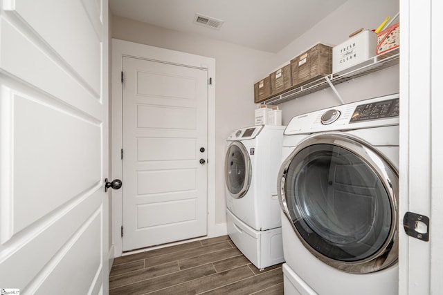 881 Cothran Rd, Inman, SC 29349 - washroom featuring washing machine and clothes dryer and dark wood-type flooring