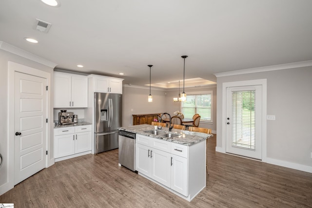 881 Cothran Rd, Inman, SC 29349 - kitchen with stainless steel appliances, ornamental molding, a sink, wood finished floors, and recessed lighting