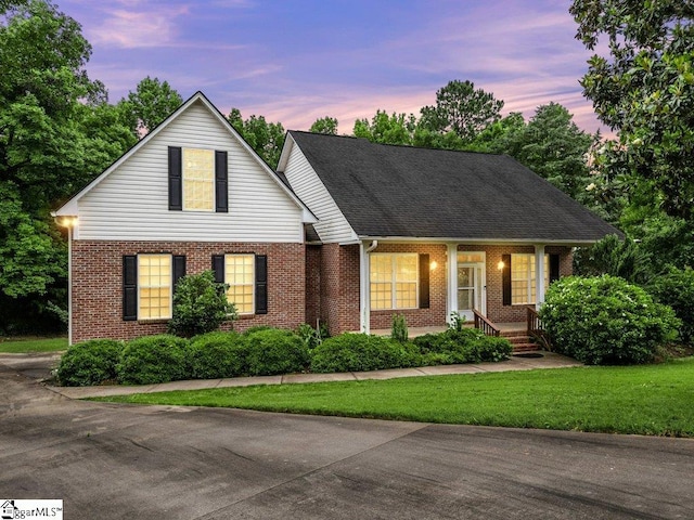 251 Saddlebrook Dr, Moore, SC 29369 - view of front of home with brick siding, covered porch, and a front lawn