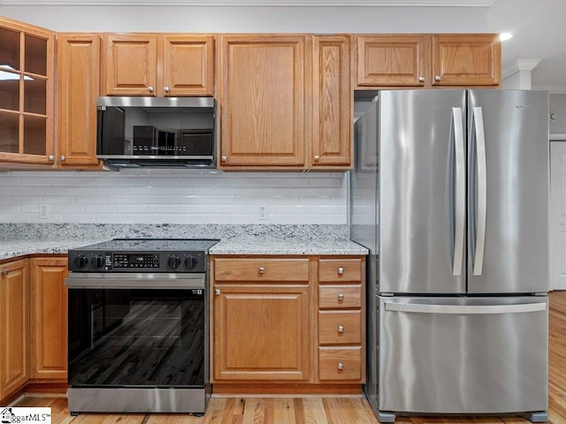 251 Saddlebrook Dr, Moore, SC 29369 - kitchen featuring freestanding refrigerator, electric range, light stone counters, glass insert cabinets, and ornamental molding