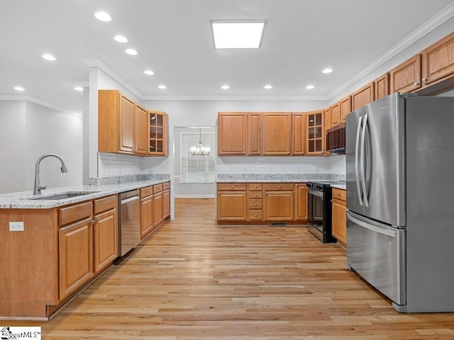 251 Saddlebrook Dr, Moore, SC 29369 - kitchen featuring appliances with stainless steel finishes, a sink, ornamental molding, light wood-type flooring, and glass insert cabinets