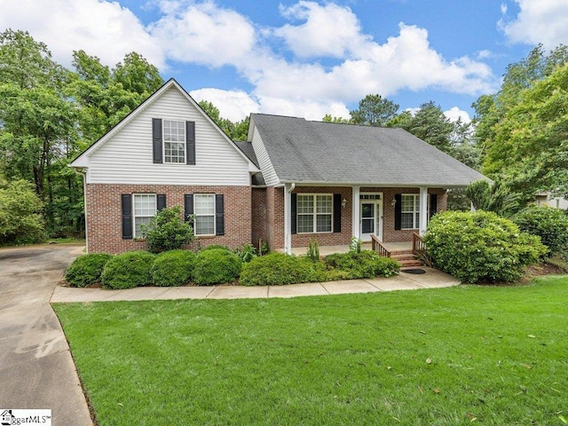251 Saddlebrook Dr, Moore, SC 29369 - view of front of home featuring brick siding, covered porch, a front lawn, and concrete driveway