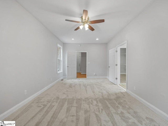 251 Saddlebrook Dr, Moore, SC 29369 - unfurnished bedroom featuring a walk in closet, light carpet, baseboards, recessed lighting, and a ceiling fan