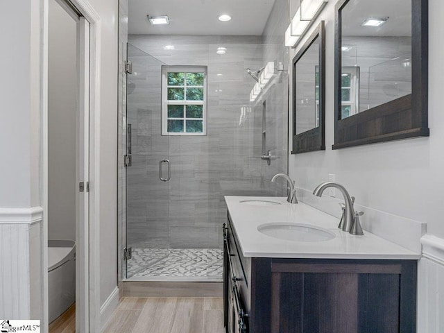 251 Saddlebrook Dr, Moore, SC 29369 - full bath with double vanity, a stall shower, wood finished floors, and toilet