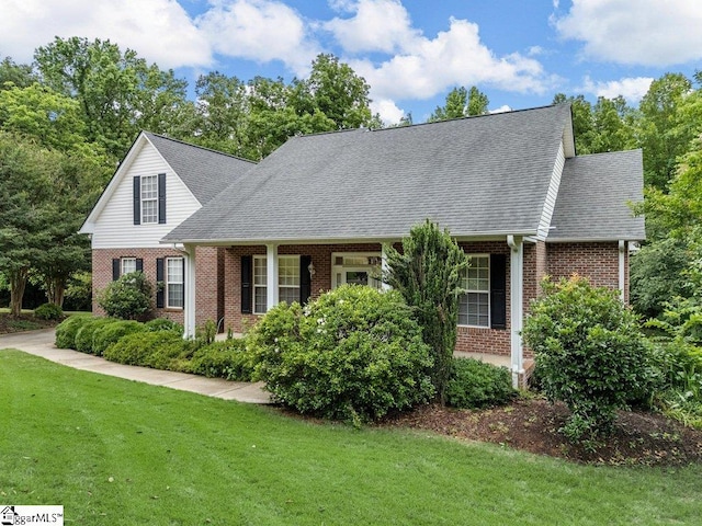 251 Saddlebrook Dr, Moore, SC 29369 - new england style home with brick siding, a front lawn, and roof with shingles