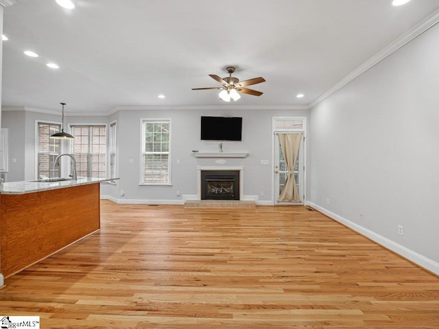 251 Saddlebrook Dr, Moore, SC 29369 - unfurnished living room with recessed lighting, a glass covered fireplace, light wood finished floors, ceiling fan, and baseboards