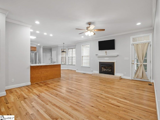 251 Saddlebrook Dr, Moore, SC 29369 - unfurnished living room with crown molding, light wood finished floors, baseboards, recessed lighting, and a ceiling fan