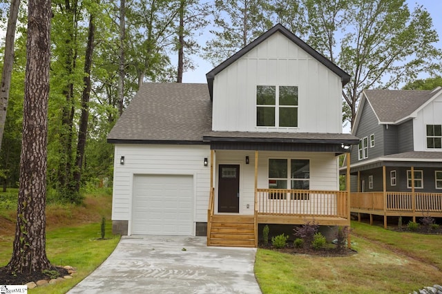 114 Hillcrest Cir Unit A, Anderson, SC 29624 - view of front of house with an attached garage, covered porch, board and batten siding, driveway, and a front yard