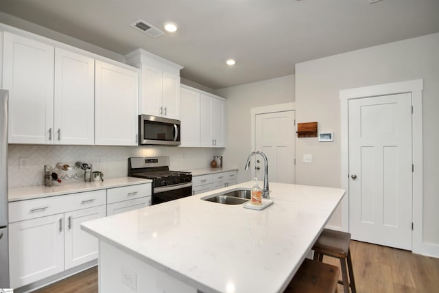 105 Boren Way, Greenville, SC 29607 - kitchen featuring stainless steel microwave, a sink, gas stove, backsplash, and recessed lighting
