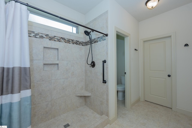 26 Bradstock Dr, Greer, SC 29650 - bathroom with tiled shower, toilet, and baseboards