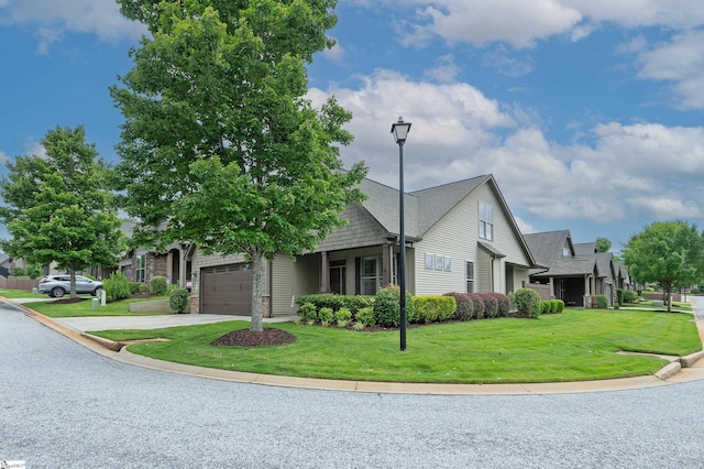 26 Bradstock Dr, Greer, SC 29650 - view of front of property featuring an attached garage, a front lawn, and concrete driveway