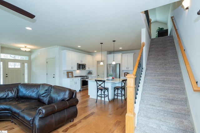 26 Bradstock Dr, Greer, SC 29650 - living area featuring stairway, light wood-style flooring, and recessed lighting