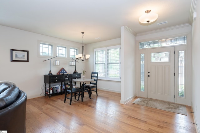26 Bradstock Dr, Greer, SC 29650 - foyer entrance featuring baseboards, light wood-type flooring, a chandelier, and ornamental molding