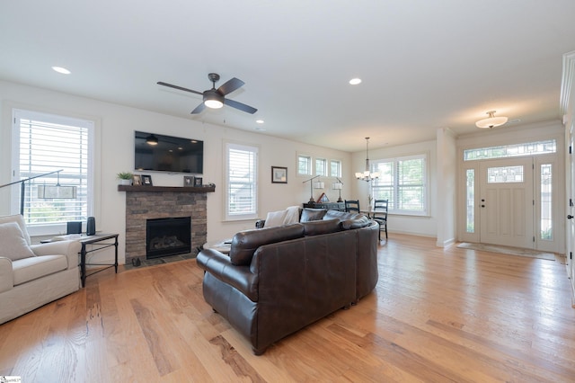26 Bradstock Dr, Greer, SC 29650 - living area featuring light wood-style flooring, a fireplace, a chandelier, baseboards, and recessed lighting