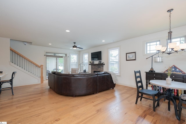 26 Bradstock Dr, Greer, SC 29650 - living room featuring stairway, light wood-style floors, a chandelier, baseboards, and recessed lighting