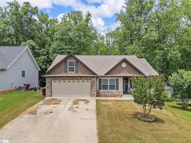 227 Heritage Creek Dr, Boiling Springs, SC 29316 - craftsman house featuring driveway, a front lawn, central AC, and stone siding