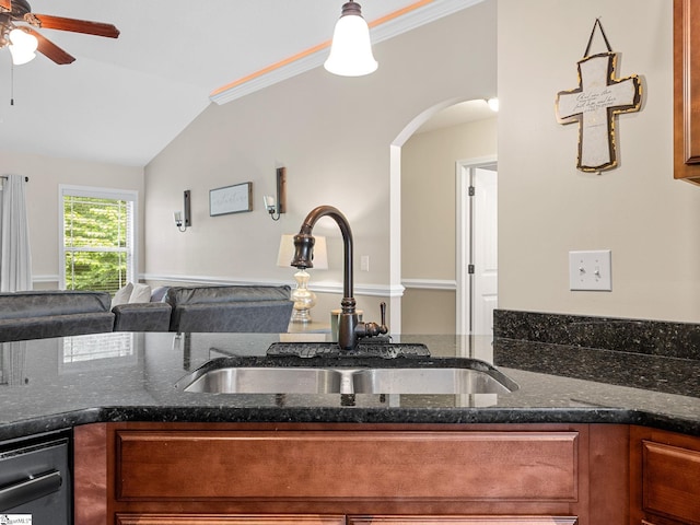 227 Heritage Creek Dr, Boiling Springs, SC 29316 - kitchen featuring a sink, arched walkways, a ceiling fan, lofted ceiling, and brown cabinetry