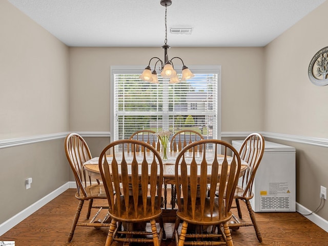 227 Heritage Creek Dr, Boiling Springs, SC 29316 - dining space featuring a chandelier, plenty of natural light, and wood finished floors