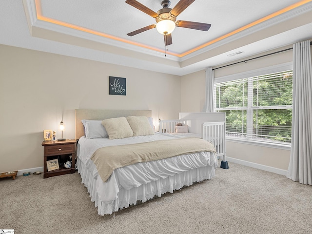 227 Heritage Creek Dr, Boiling Springs, SC 29316 - carpeted bedroom featuring a tray ceiling, baseboards, crown molding, and a ceiling fan