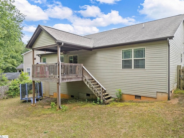 227 Heritage Creek Dr, Boiling Springs, SC 29316 - back of property featuring crawl space, a trampoline, a deck, stairway, and a shingled roof