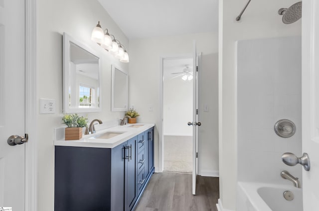 376 Woodsberry Shoals Dr, Duncan, SC 29334 - bathroom featuring wood finished floors, bathing tub / shower combination, double vanity, and ceiling fan