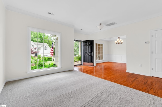 376 Woodsberry Shoals Dr, Duncan, SC 29334 - empty room featuring a chandelier, wood finished floors, and a wainscoted wall