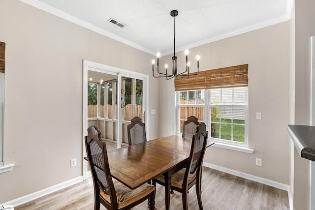 16 N Orchard Farms Ave, Simpsonville, SC 29681 - dining area with a chandelier, light wood-style flooring, ornamental molding, and baseboards