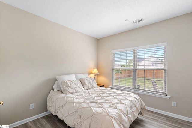 16 N Orchard Farms Ave, Simpsonville, SC 29681 - bedroom featuring baseboards, multiple windows, and wood finished floors