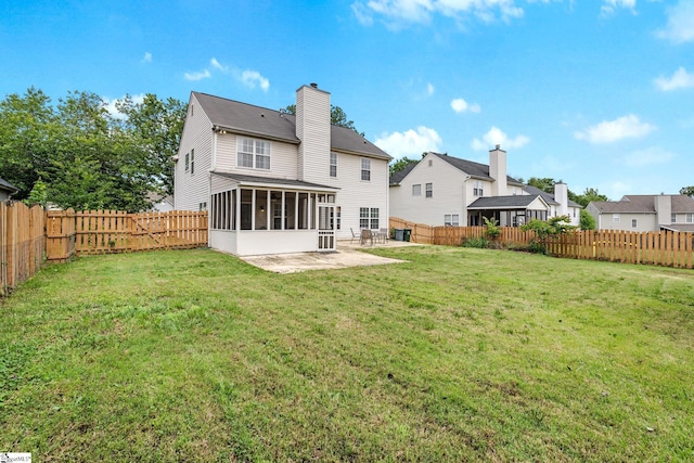 16 N Orchard Farms Ave, Simpsonville, SC 29681 - rear view of house featuring a sunroom, a patio area, and a chimney