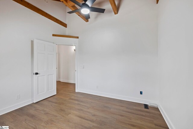 868 Old Hundred Rd, Pelzer, SC 29669 - spare room with beamed ceiling, wood finished floors, baseboards, ceiling fan, and high vaulted ceiling