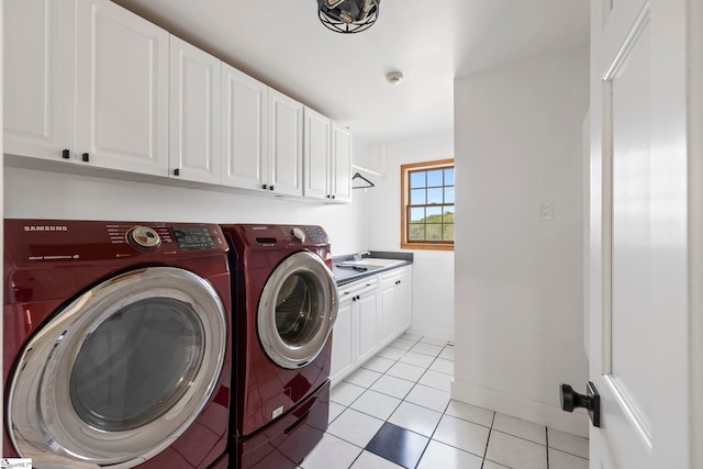 868 Old Hundred Rd, Pelzer, SC 29669 - laundry area with washer and dryer, cabinet space, light tile patterned flooring, and baseboards