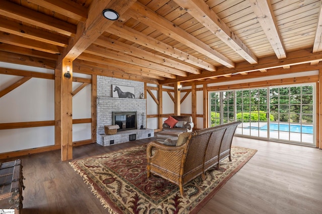 868 Old Hundred Rd, Pelzer, SC 29669 - living area featuring a fireplace, wood finished floors, and wooden ceiling with exposed beams