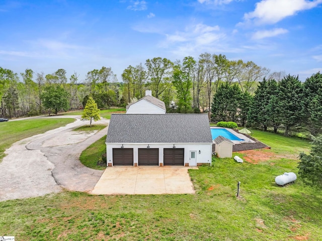 868 Old Hundred Rd, Pelzer, SC 29669 - view of side of home with a lawn, a garage, concrete driveway, a pool, and a chimney