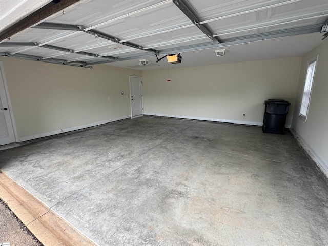 garage featuring baseboards and a garage door opener