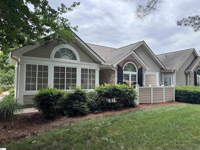 view of home's exterior featuring roof with shingles