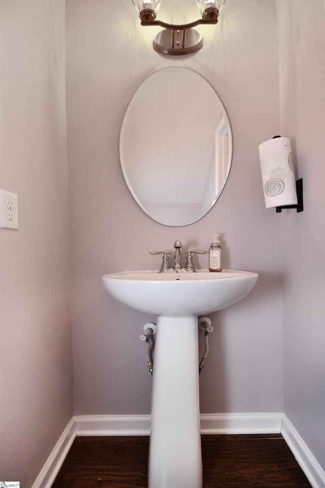 41 Irvington Dr, Greer, SC 29650 - bathroom with baseboards, wood finished floors, and a sink