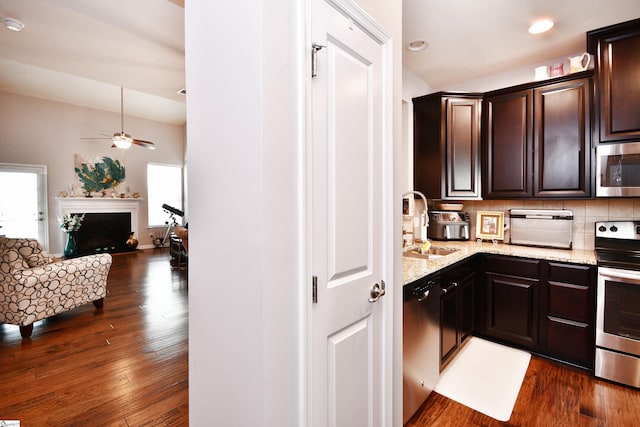 41 Irvington Dr, Greer, SC 29650 - kitchen with appliances with stainless steel finishes, a sink, a ceiling fan, light stone counters, and dark wood-style floors
