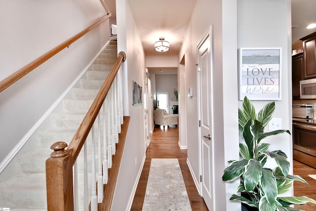41 Irvington Dr, Greer, SC 29650 - hall with stairs, dark wood finished floors, and baseboards