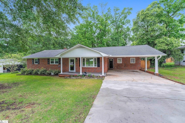 502 Hunts Bridge Rd, Greenville, SC 29617 - ranch-style house with concrete driveway, a front yard, brick siding, a porch, and a carport