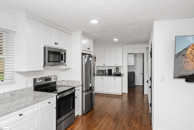 502 Hunts Bridge Rd, Greenville, SC 29617 - kitchen featuring appliances with stainless steel finishes, washer / dryer, white cabinetry, recessed lighting, and dark wood-type flooring